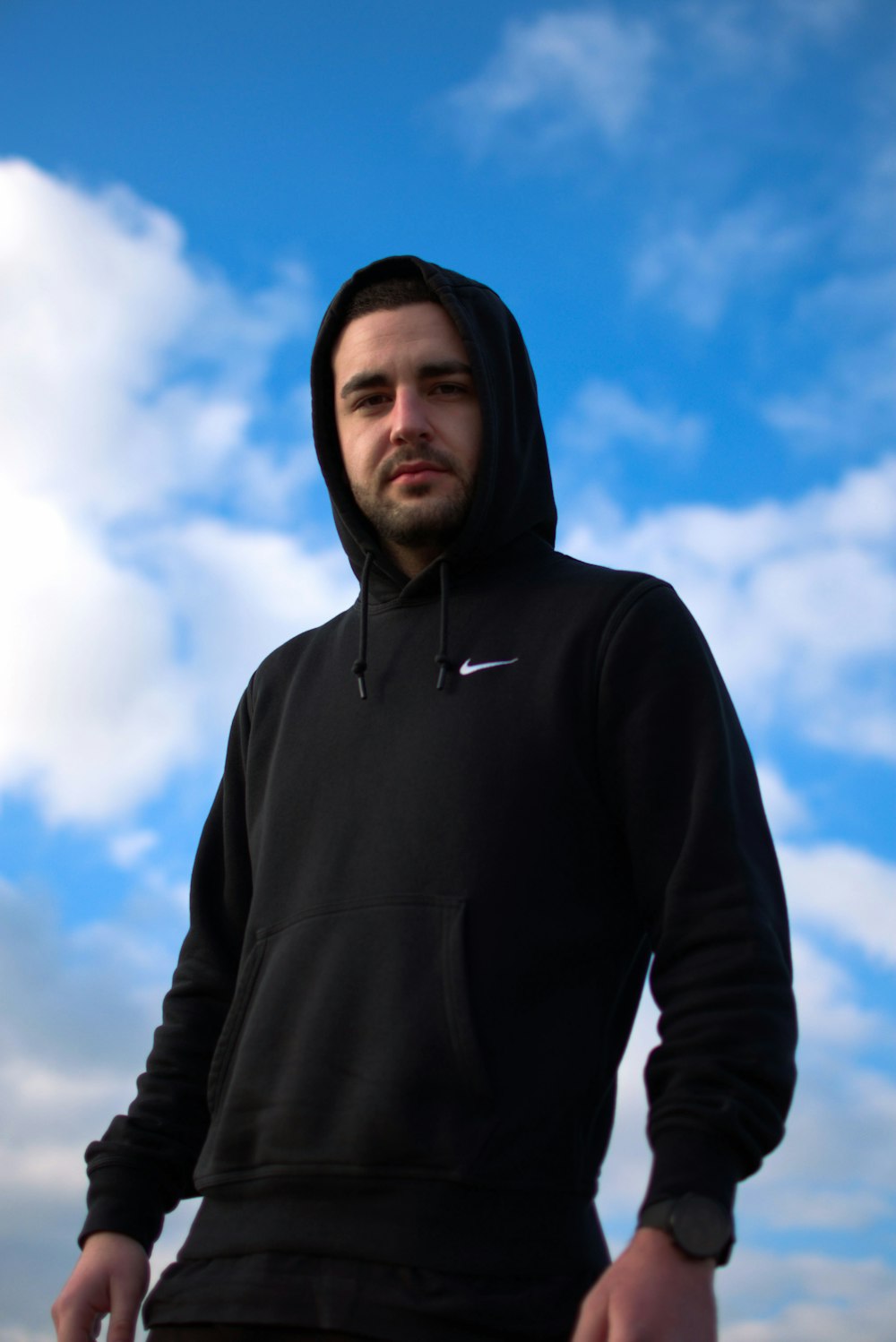 man in black hoodie under blue sky during daytime