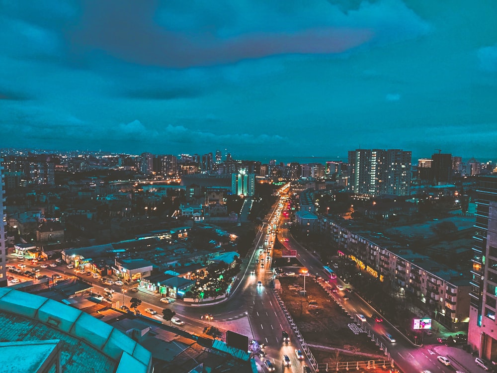 city with high rise buildings during night time