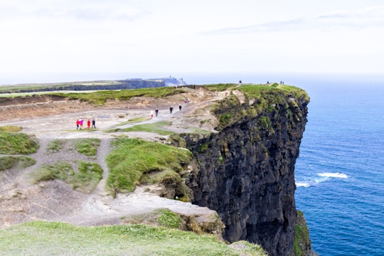 people on beach during daytime in County Clare Ireland