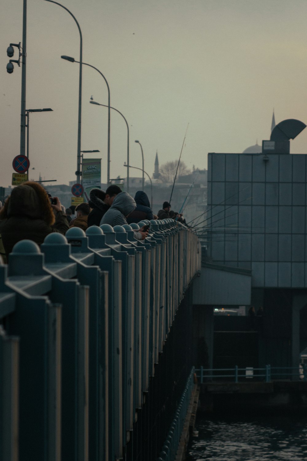 people walking on bridge during daytime