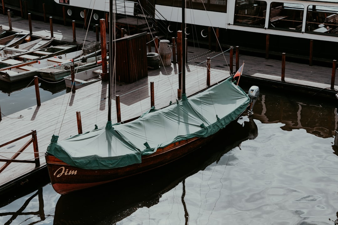 a boat that is sitting in the water, A small boat in Prague.