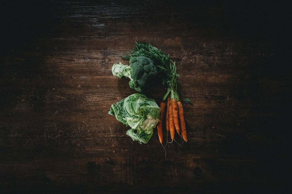 green and white vegetable on brown wooden table