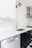 white wooden kitchen cabinet near white wooden kitchen cabinet