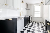 white wooden door near white wooden kitchen cabinet