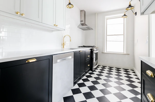 white wooden door near white wooden kitchen cabinet