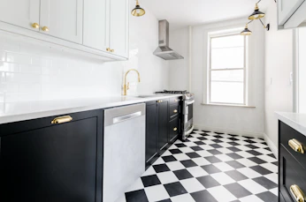 white wooden door near white wooden kitchen cabinet