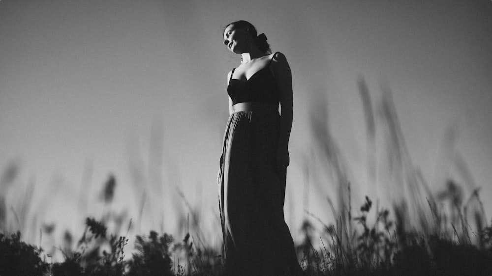 grayscale photo of woman in black dress