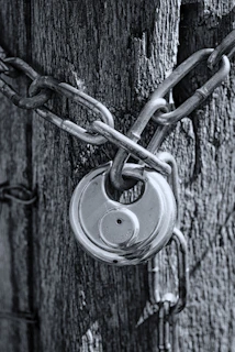 gray scale photo of chain link fence