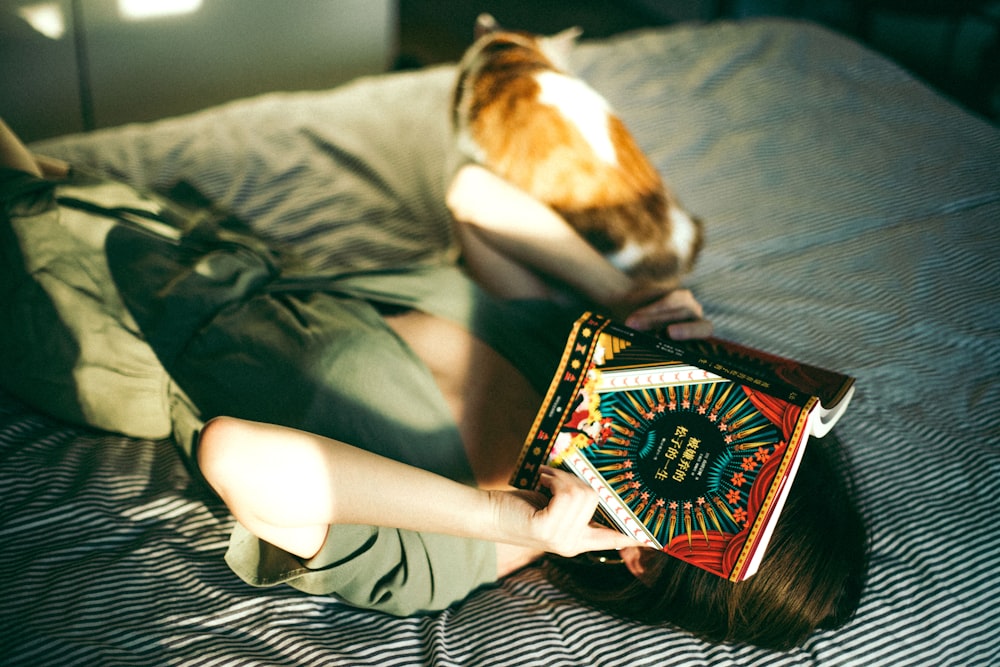 person in gray t-shirt lying on bed