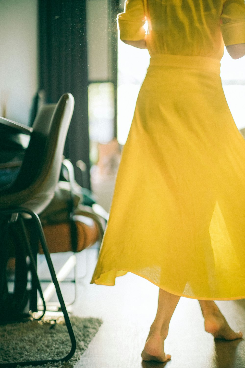 yellow dress on black chair