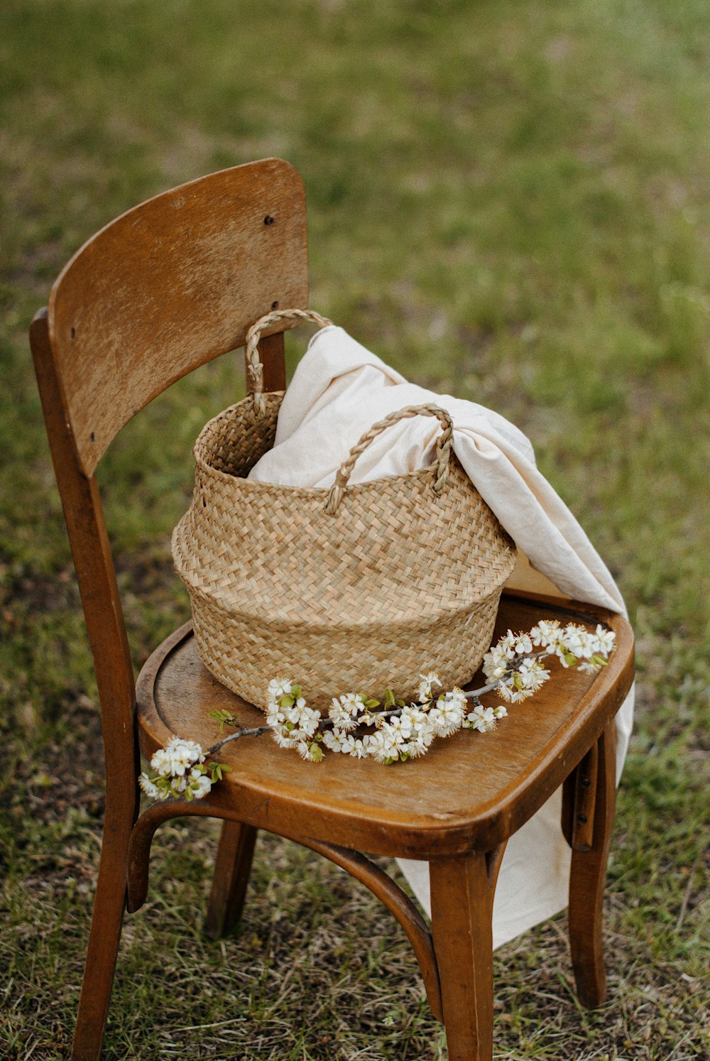 brown woven basket on brown wooden chair