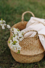 white flowers in brown woven basket