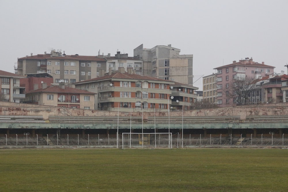 brown concrete building near green grass field during daytime