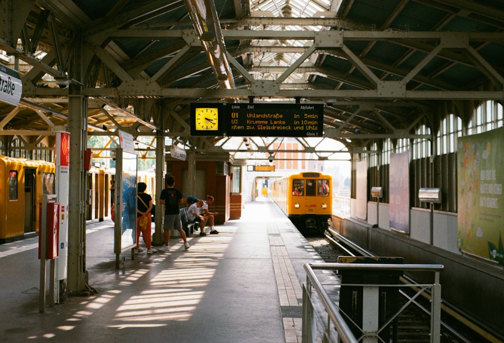 people walking on train station during daytime