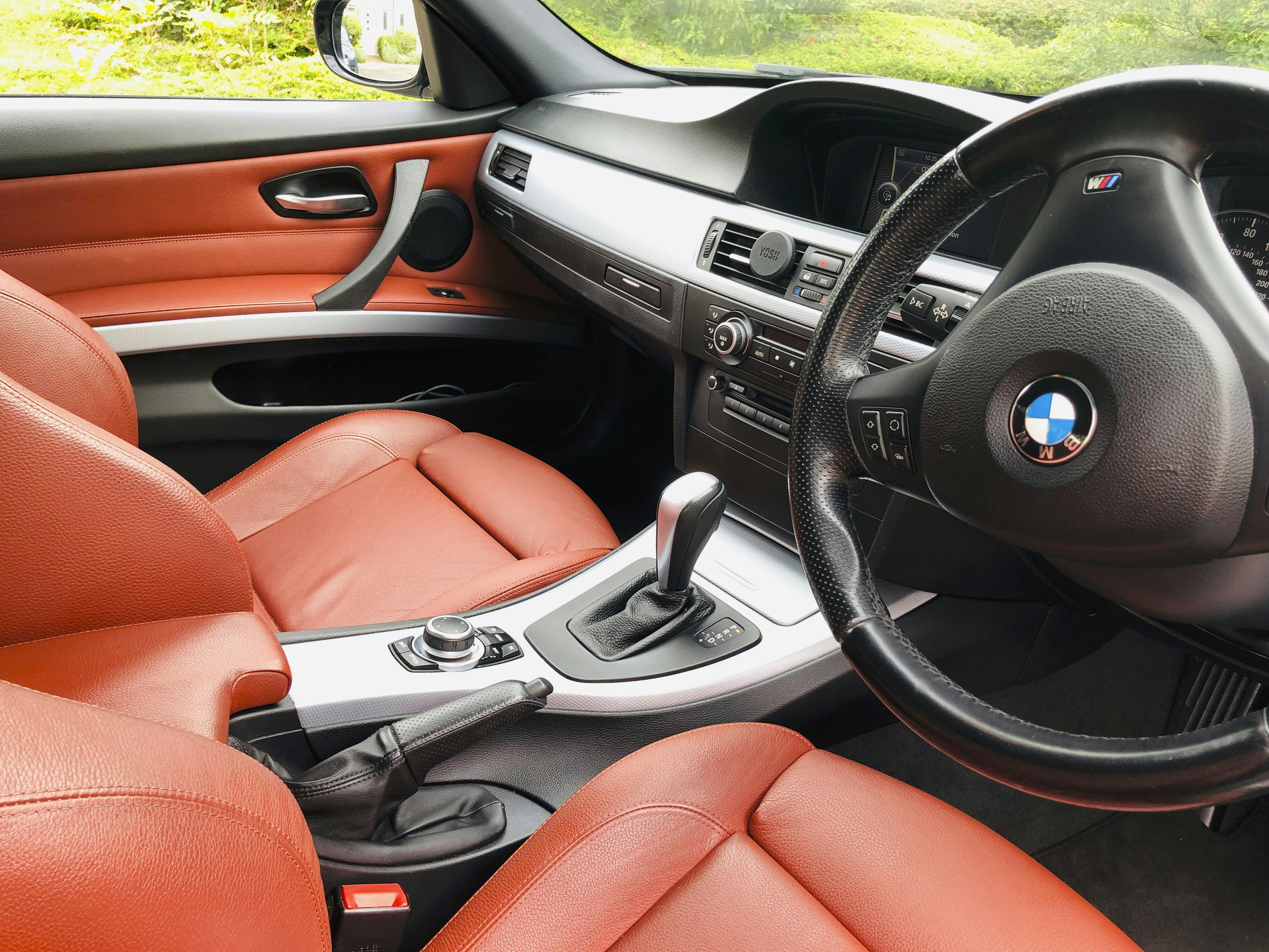 black and orange car steering wheel