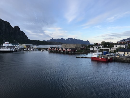 red boat on body of water during daytime in Svolvær Norway