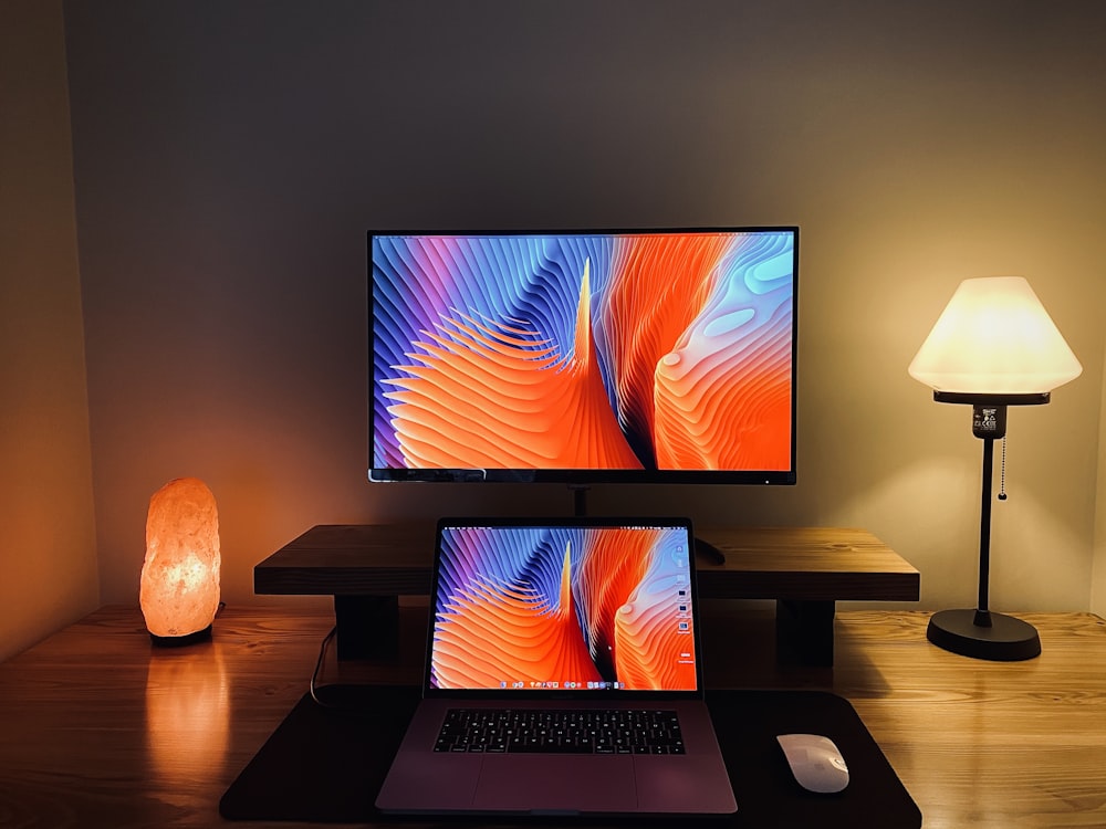 macbook pro on brown wooden table