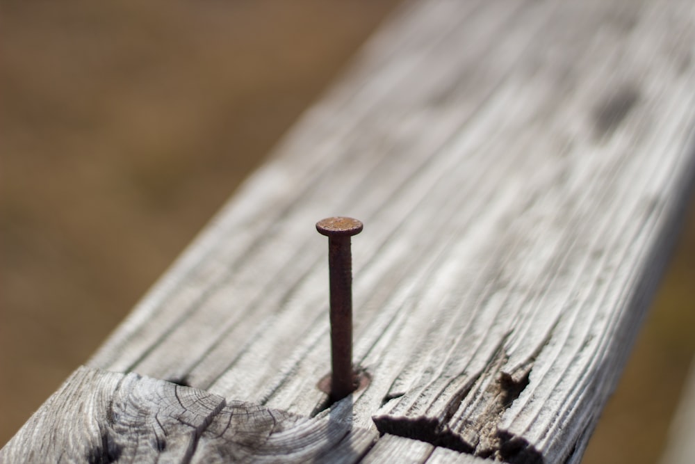 brown wooden stick on brown wooden surface