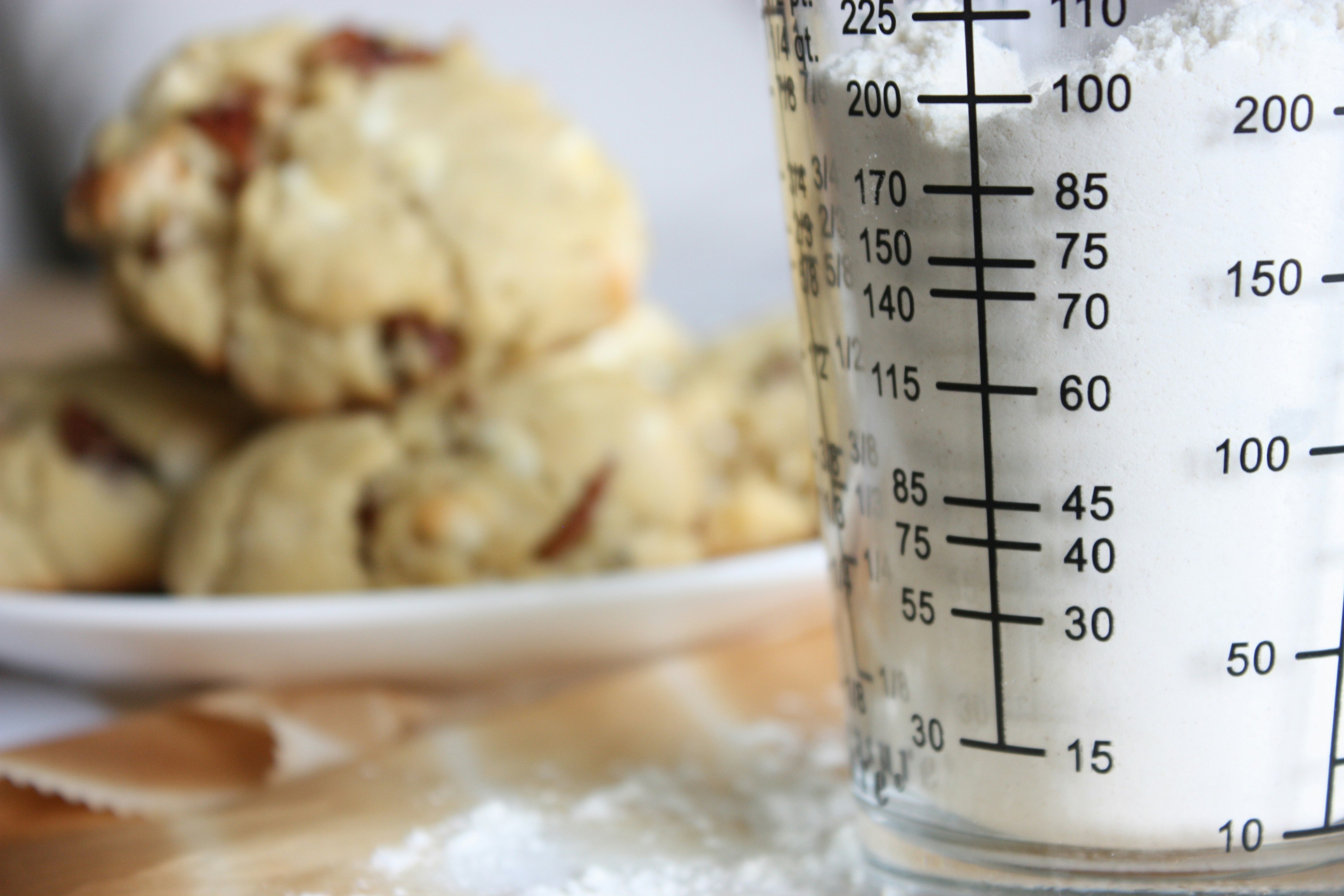 Measuring glass with flour in a kitchen