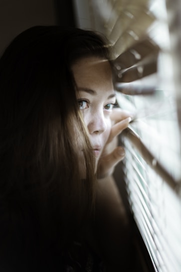 woman looking at the window