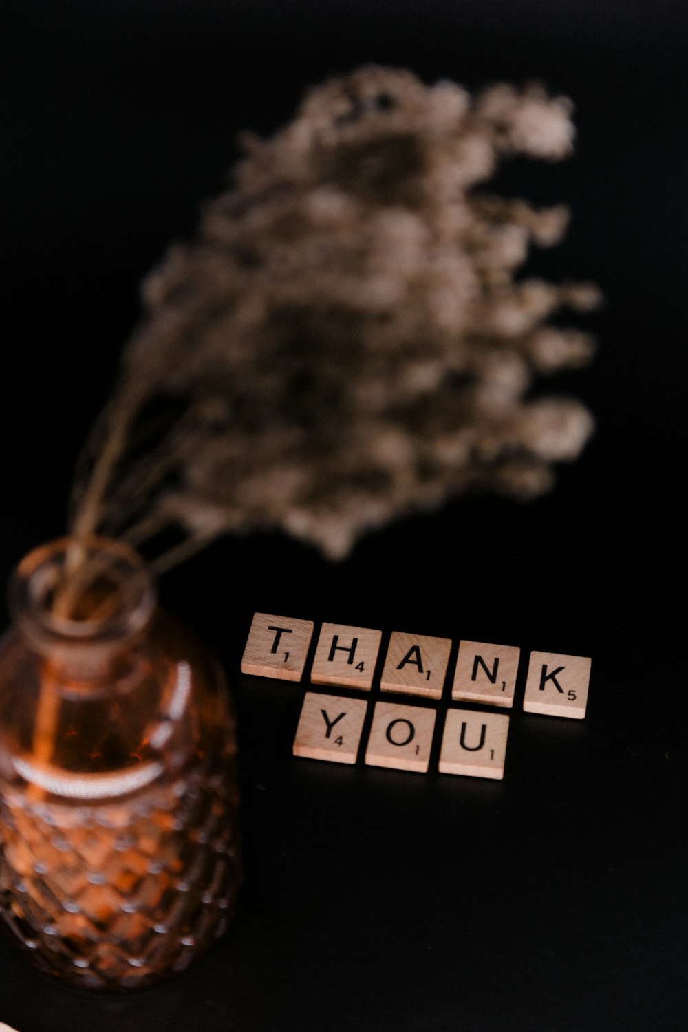 clear glass bottle with white powder