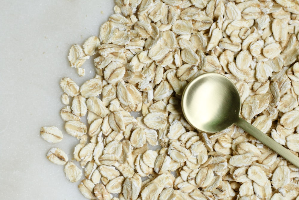 brown rice on white textile