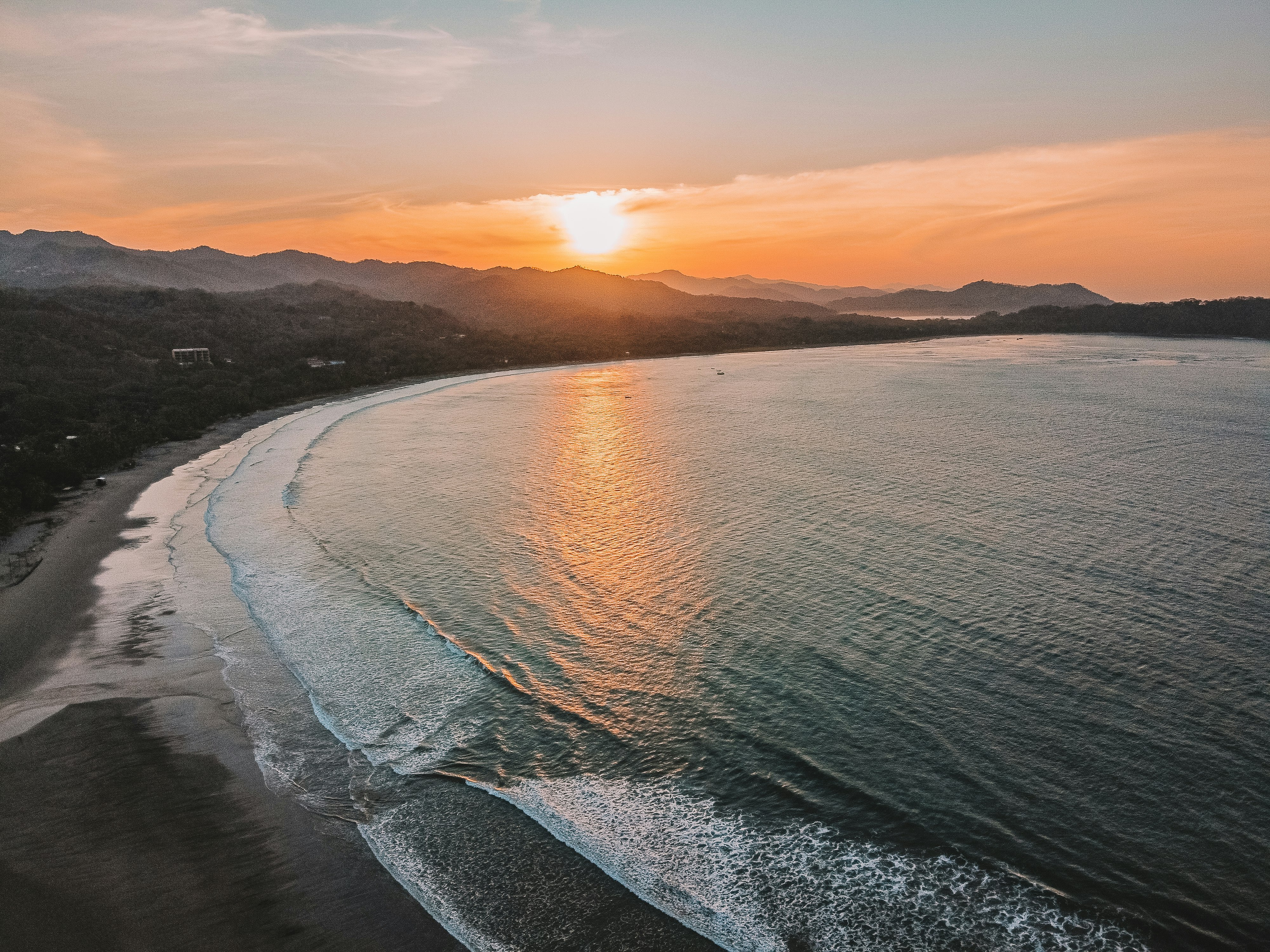 body of water during sunset