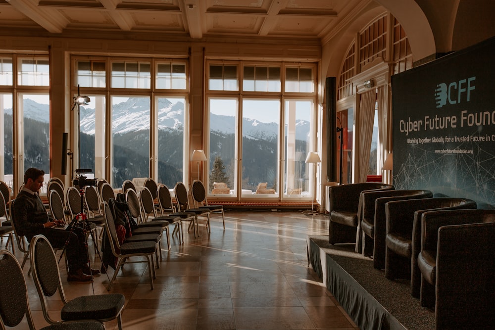 black padded chairs on brown wooden floor