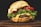 A juicy cheeseburger with a sesame seed bun, fresh green lettuce, and thick slices of tomato. Melted cheese oozes over the beef patty, enhancing its rich, savory appearance.