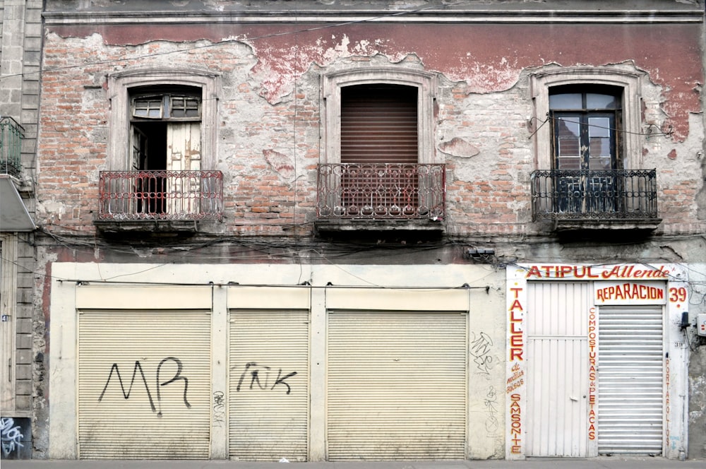 white wooden window on brown brick wall