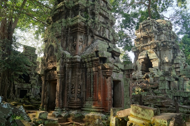 Ancient temple ruins surrounded by jungle foliage, capturing Thailand’s rich history.