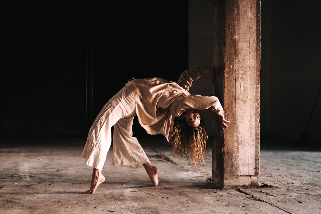 woman in white dress walking on gray concrete floor