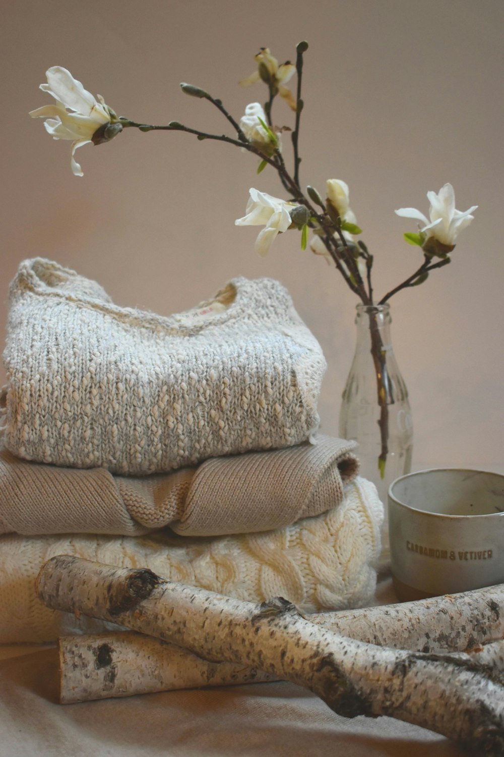 white and yellow flower on white ceramic vase