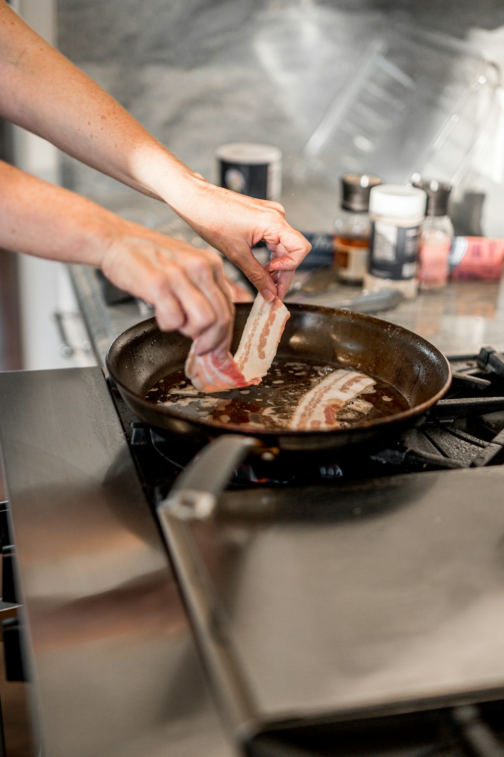 person holding brown wooden chopping board