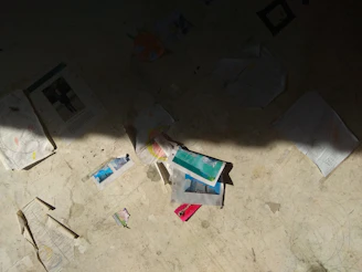 An artistic photo of scattered papers and a laptop screen showing a recovered file, representing yesterday's project found.