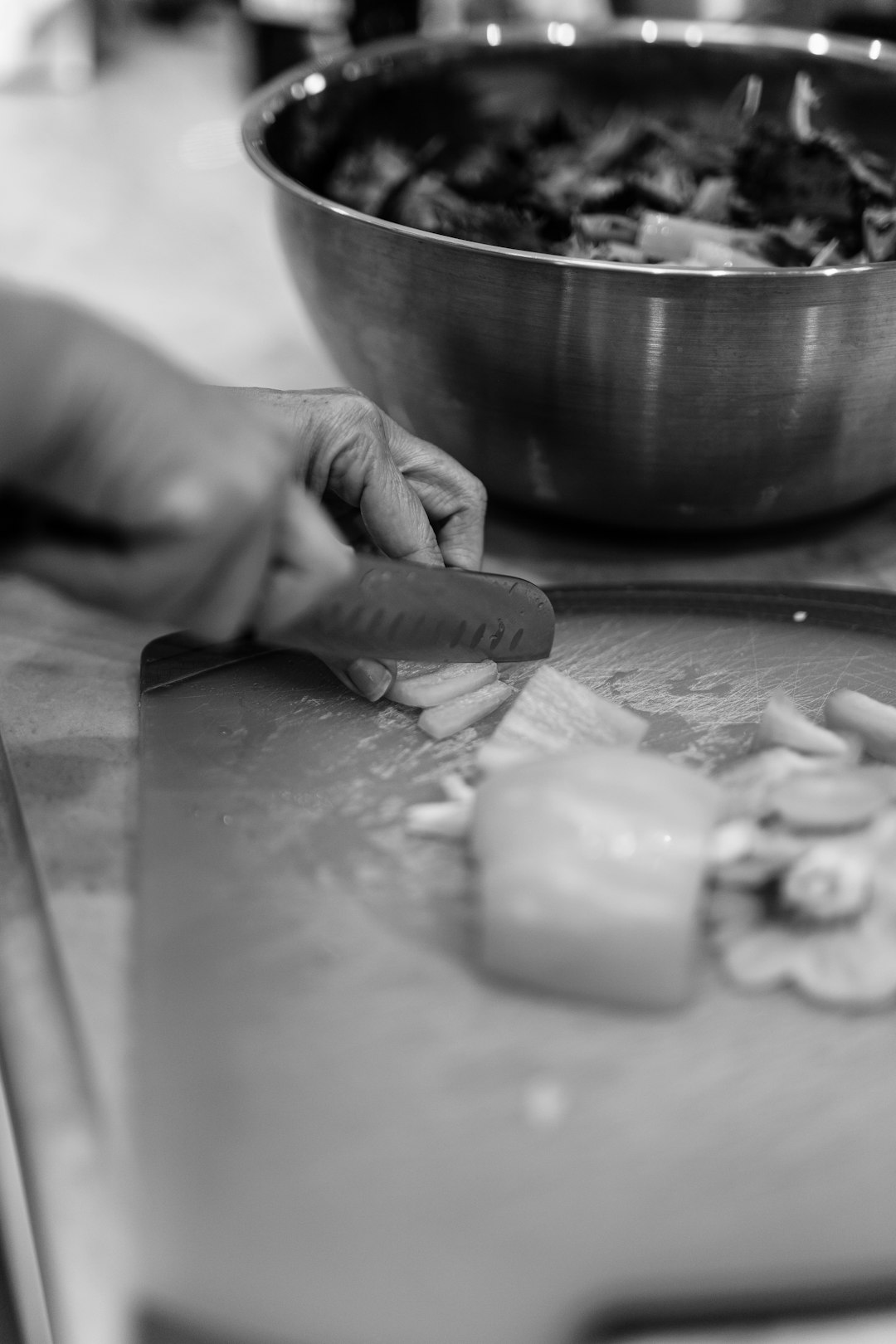 grayscale photo of person holding round plate