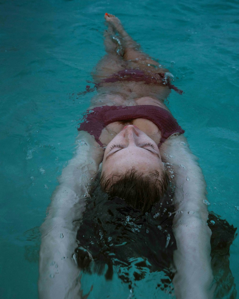 man in swimming pool during daytime