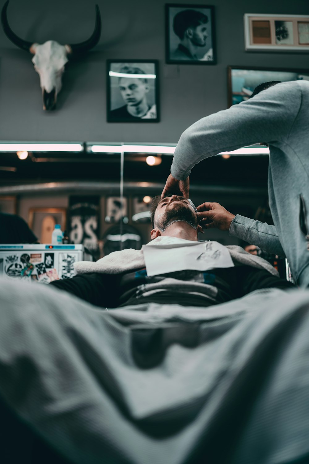 man in black long sleeve shirt lying on hospital bed