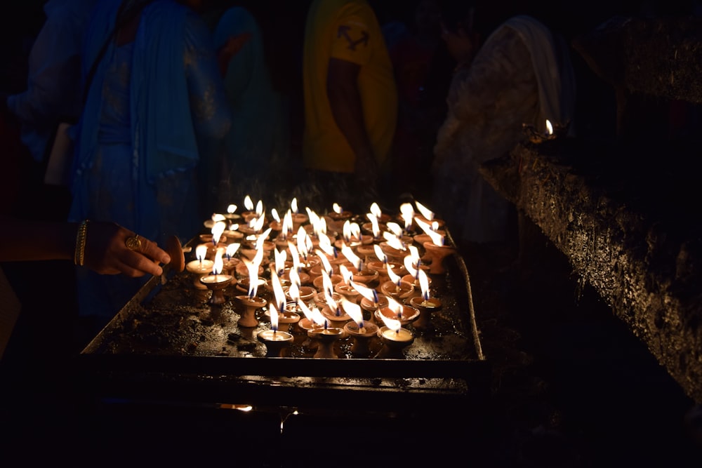 people standing in front of fire pit