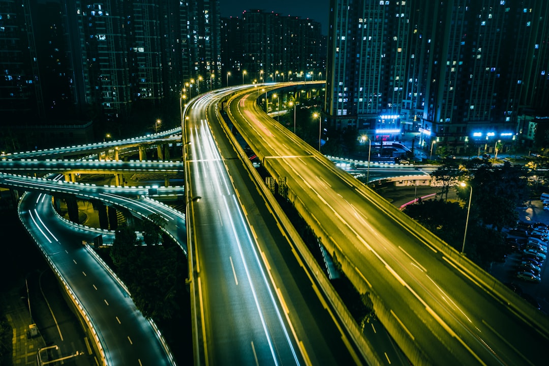 time lapse photography of cars on road during night time