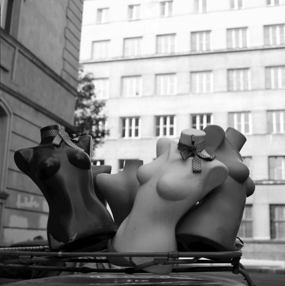 grayscale photo of woman sitting on bench