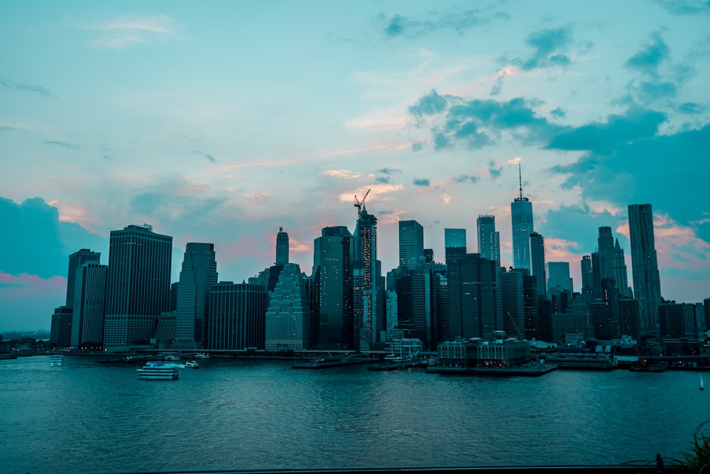 city skyline under cloudy sky during daytime