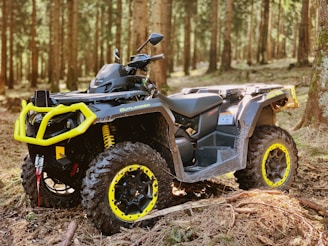 black and gray atv on brown soil