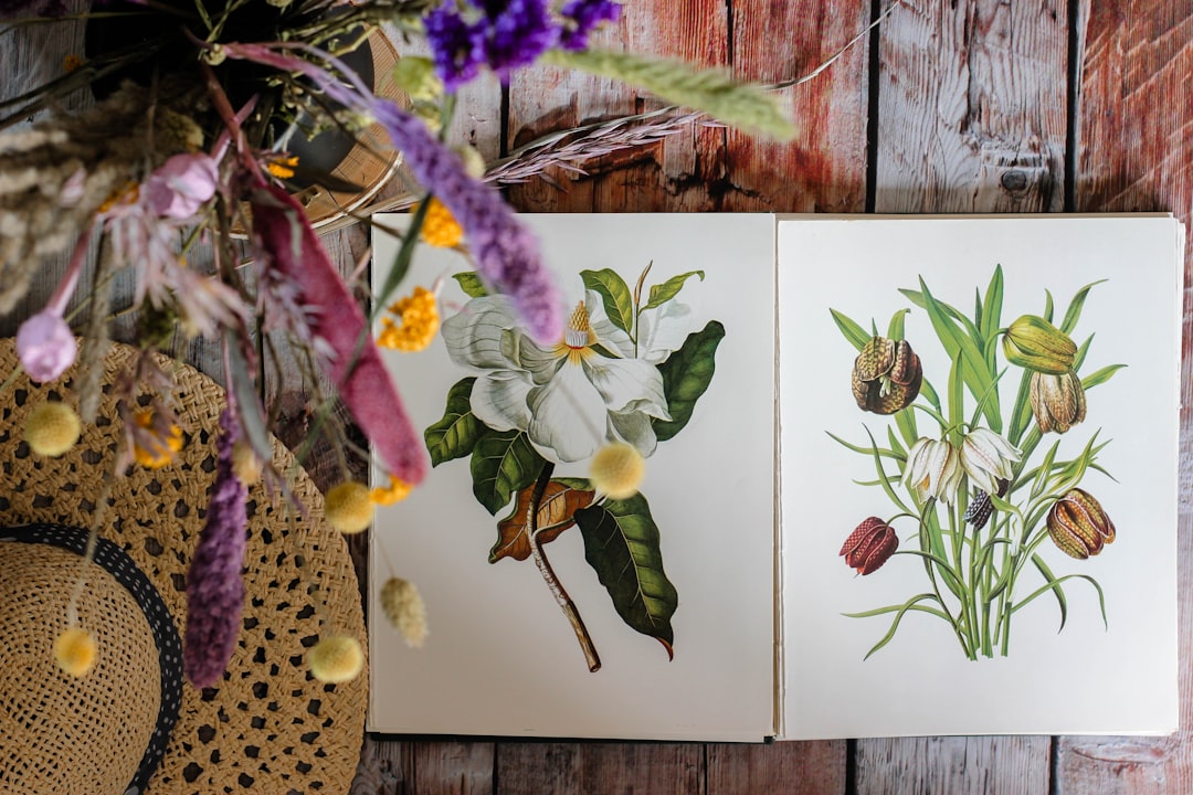 purple and white flowers on brown wooden wall