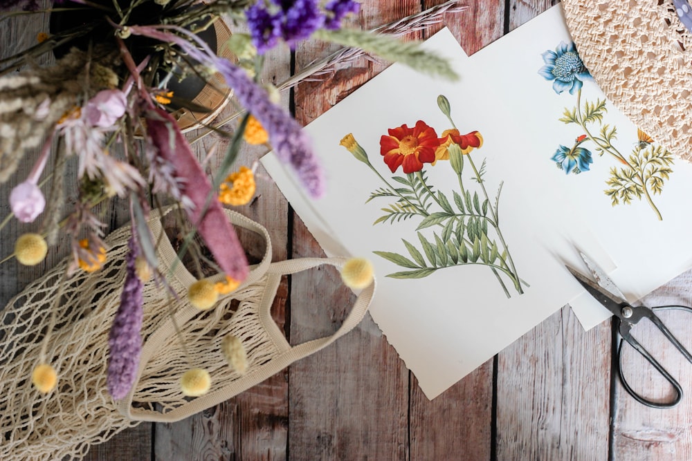 white and yellow flowers on white paper