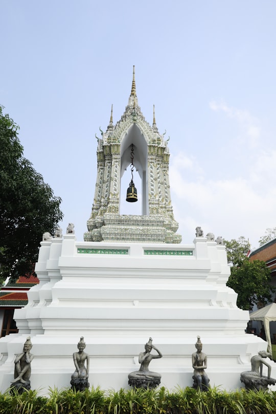 white concrete building under white sky during daytime in Wat Phra Chetuphon Vimolmangklararm Rajwaramahaviharn Thailand