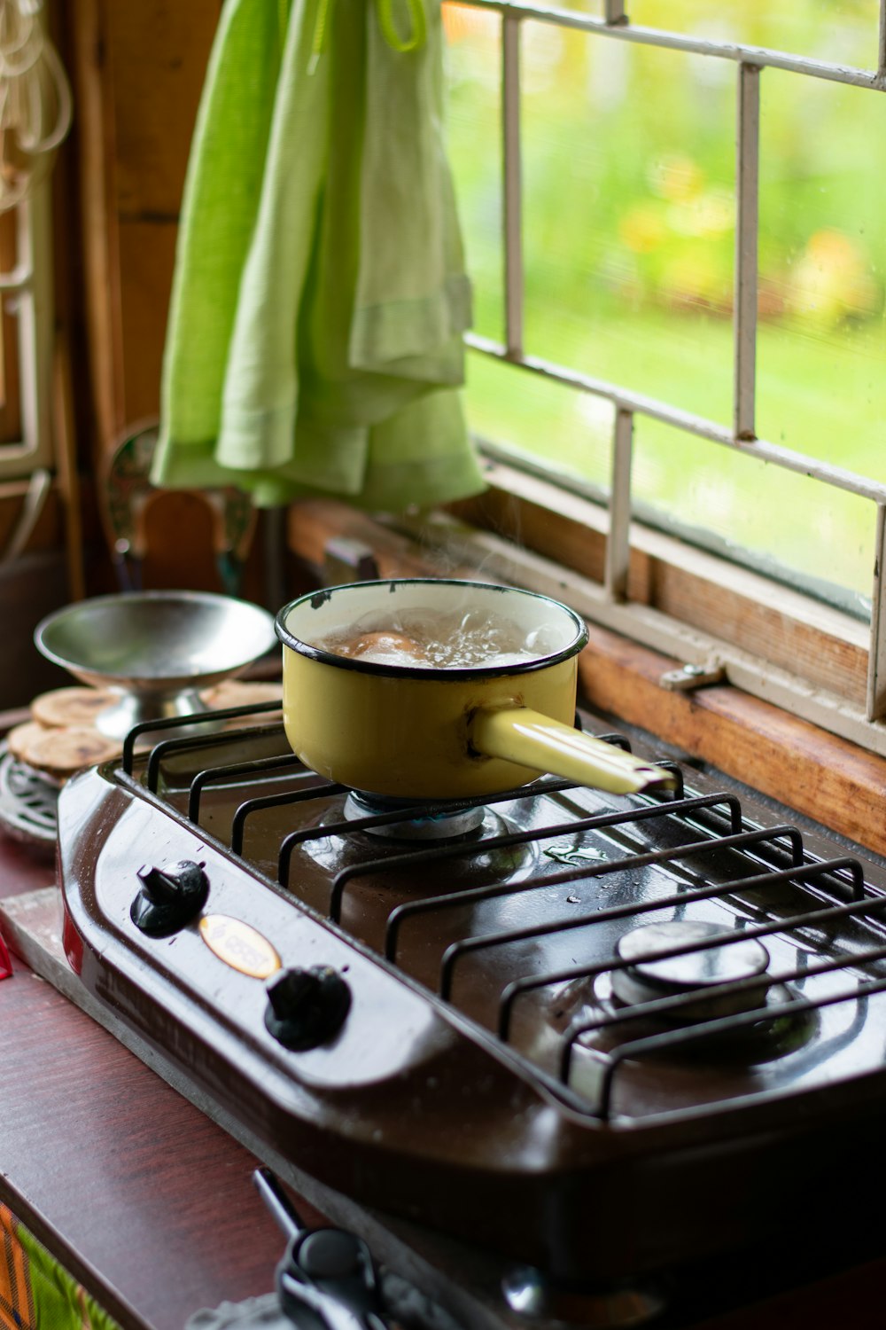 stainless steel cooking pot on gas stove