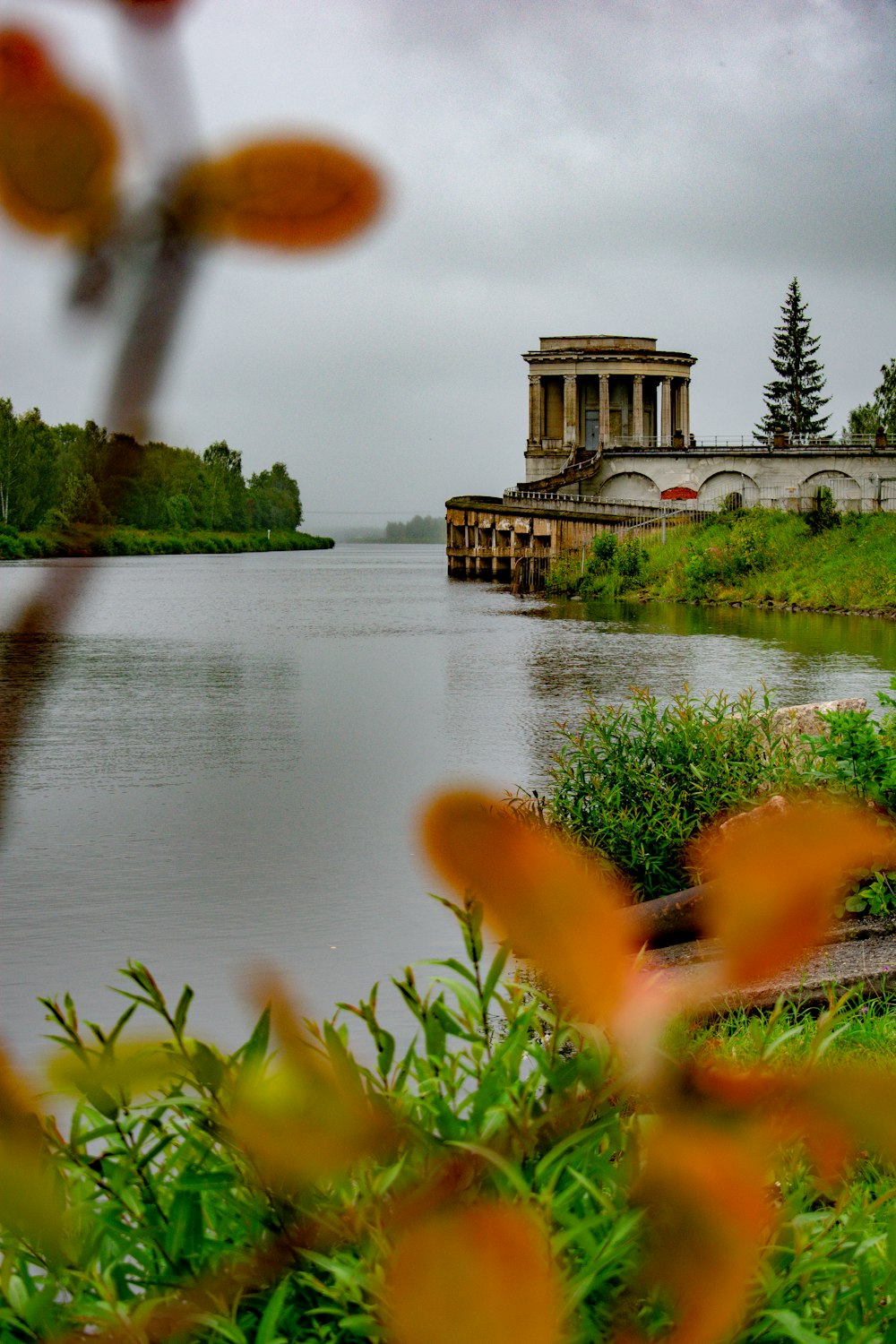 brown concrete building near body of water during daytime