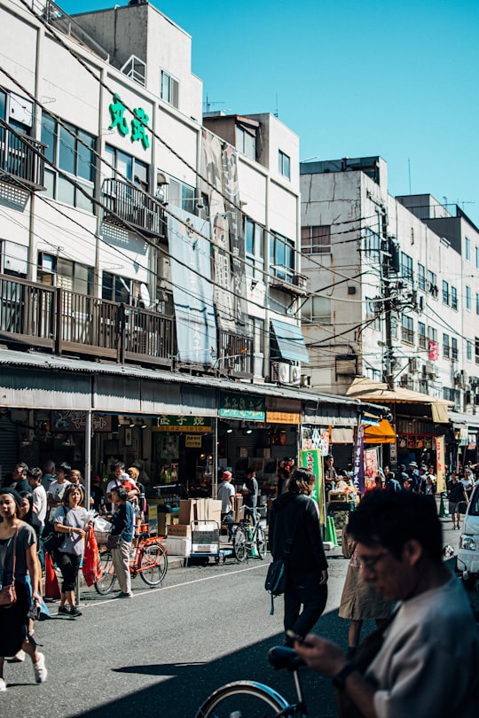 people walking on street during daytime in Tsukiji Japan