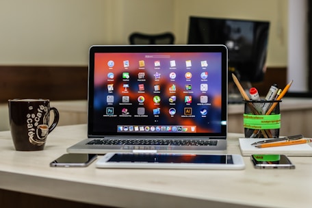 macbook pro on white table